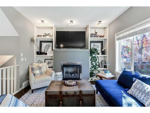 264 Brightonwoods Gardens Se, Calgary, AB - Indoor Photo Showing Living Room With Fireplace