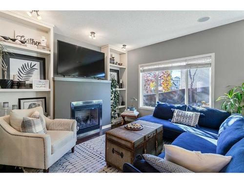 264 Brightonwoods Gardens Se, Calgary, AB - Indoor Photo Showing Living Room With Fireplace