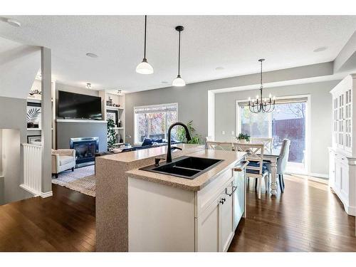 264 Brightonwoods Gardens Se, Calgary, AB - Indoor Photo Showing Kitchen With Fireplace With Double Sink