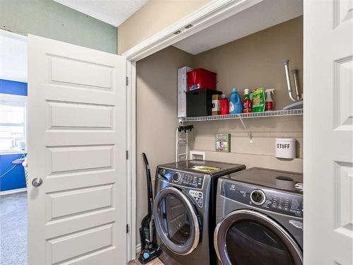 264 Brightonwoods Gardens Se, Calgary, AB - Indoor Photo Showing Laundry Room