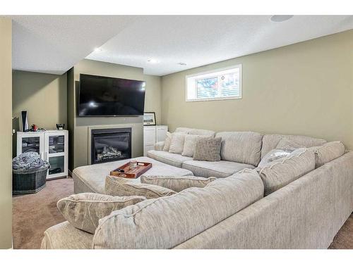 264 Brightonwoods Gardens Se, Calgary, AB - Indoor Photo Showing Living Room With Fireplace