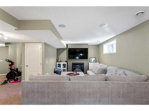 264 Brightonwoods Gardens Se, Calgary, AB - Indoor Photo Showing Living Room With Fireplace