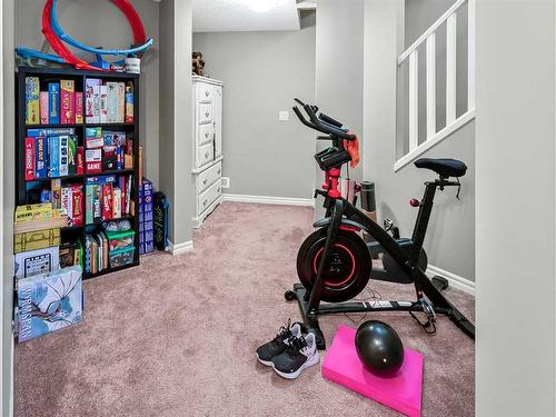 264 Brightonwoods Gardens Se, Calgary, AB - Indoor Photo Showing Gym Room