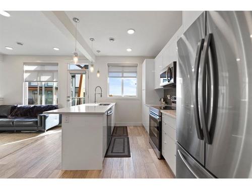 3108-410 Seton Passage Se, Calgary, AB - Indoor Photo Showing Kitchen With Stainless Steel Kitchen With Upgraded Kitchen