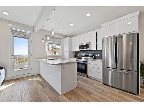 3108-410 Seton Passage Se, Calgary, AB - Indoor Photo Showing Kitchen With Stainless Steel Kitchen With Upgraded Kitchen