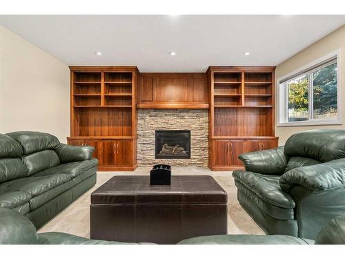 38 Woodbriar Place Sw, Calgary, AB - Indoor Photo Showing Living Room With Fireplace