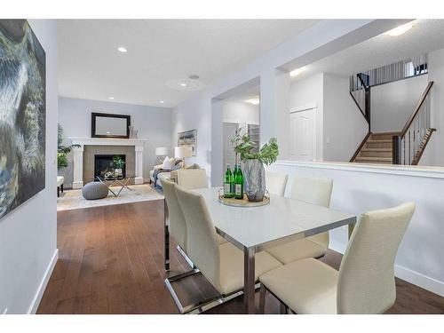 80 Evansridge View Nw, Calgary, AB - Indoor Photo Showing Dining Room With Fireplace