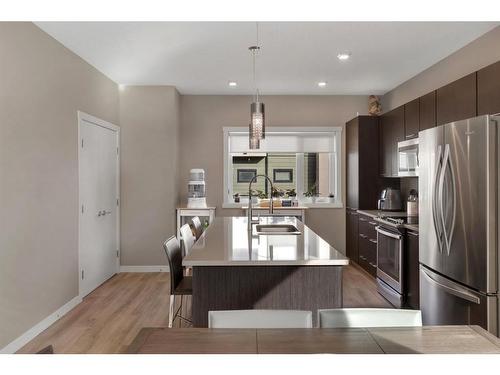 701-218 Sherwood Square Nw, Calgary, AB - Indoor Photo Showing Kitchen With Stainless Steel Kitchen With Upgraded Kitchen