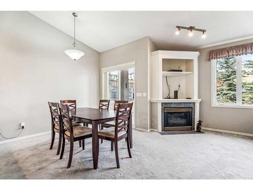 9 Edgeridge Terrace Nw, Calgary, AB - Indoor Photo Showing Dining Room With Fireplace