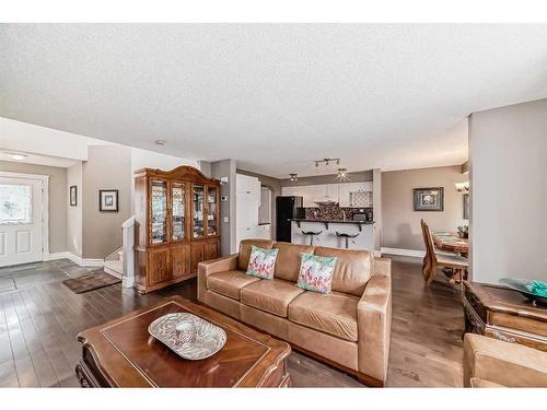 125 Cougarstone Place Sw, Calgary, AB - Indoor Photo Showing Living Room