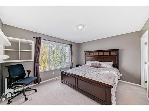 125 Cougarstone Place Sw, Calgary, AB - Indoor Photo Showing Bedroom