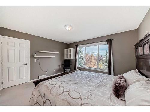 125 Cougarstone Place Sw, Calgary, AB - Indoor Photo Showing Bedroom