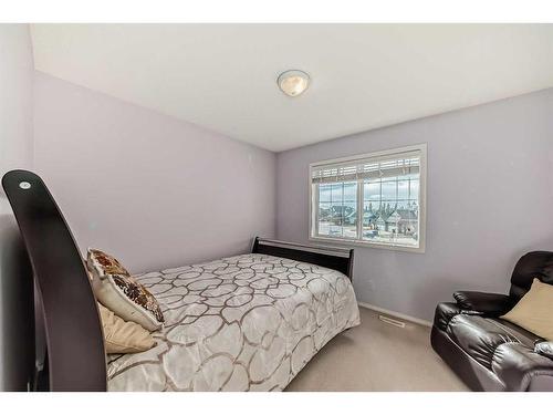 125 Cougarstone Place Sw, Calgary, AB - Indoor Photo Showing Bedroom