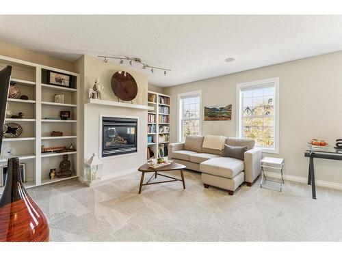 89 Somme Boulevard Sw, Calgary, AB - Indoor Photo Showing Living Room With Fireplace