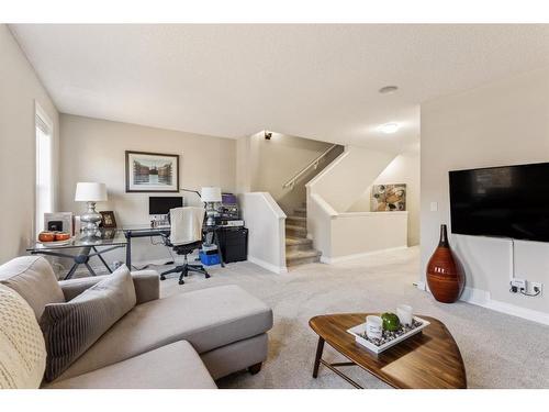 89 Somme Boulevard Sw, Calgary, AB - Indoor Photo Showing Living Room