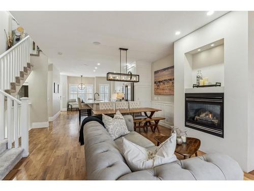 89 Somme Boulevard Sw, Calgary, AB - Indoor Photo Showing Living Room With Fireplace