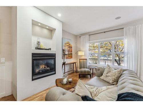 89 Somme Boulevard Sw, Calgary, AB - Indoor Photo Showing Living Room With Fireplace