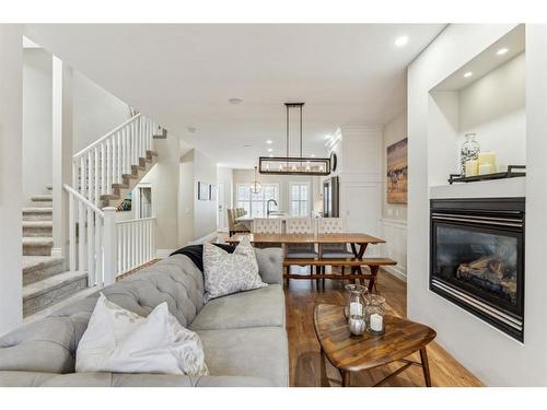 89 Somme Boulevard Sw, Calgary, AB - Indoor Photo Showing Living Room With Fireplace