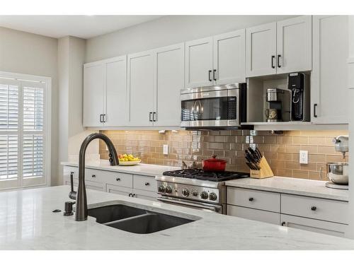 89 Somme Boulevard Sw, Calgary, AB - Indoor Photo Showing Kitchen With Double Sink With Upgraded Kitchen