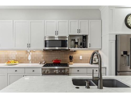 89 Somme Boulevard Sw, Calgary, AB - Indoor Photo Showing Kitchen With Double Sink With Upgraded Kitchen