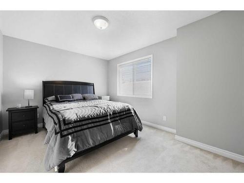 51 Crystal Shores Cove, Okotoks, AB - Indoor Photo Showing Bedroom