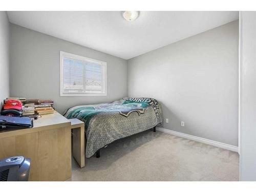 51 Crystal Shores Cove, Okotoks, AB - Indoor Photo Showing Bedroom