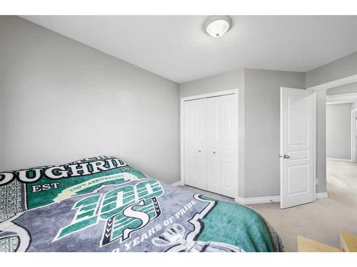 51 Crystal Shores Cove, Okotoks, AB - Indoor Photo Showing Bedroom