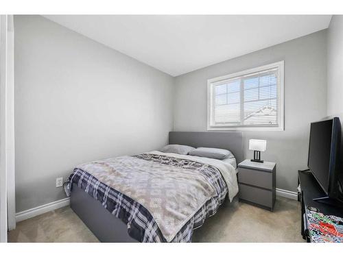 51 Crystal Shores Cove, Okotoks, AB - Indoor Photo Showing Bedroom