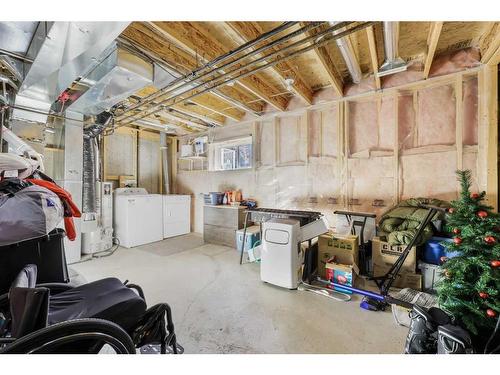 51 Crystal Shores Cove, Okotoks, AB - Indoor Photo Showing Basement