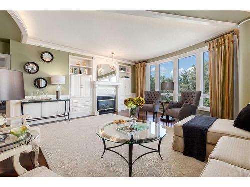 6501-400 Eau Claire Avenue Sw, Calgary, AB - Indoor Photo Showing Living Room With Fireplace