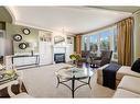 6501-400 Eau Claire Avenue Sw, Calgary, AB  - Indoor Photo Showing Living Room With Fireplace 