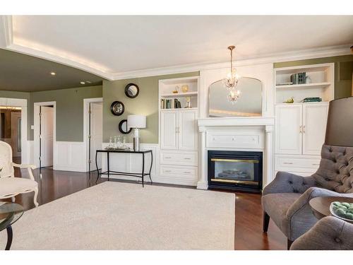 6501-400 Eau Claire Avenue Sw, Calgary, AB - Indoor Photo Showing Living Room With Fireplace