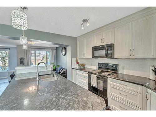 454 Auburn Crest Way Se, Calgary, AB - Indoor Photo Showing Kitchen With Double Sink