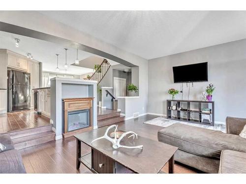 454 Auburn Crest Way Se, Calgary, AB - Indoor Photo Showing Living Room With Fireplace