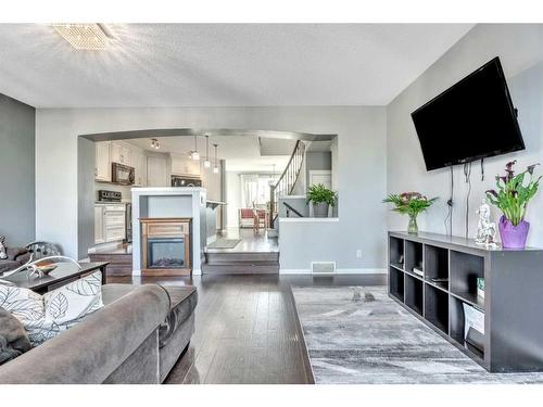 454 Auburn Crest Way Se, Calgary, AB - Indoor Photo Showing Living Room With Fireplace