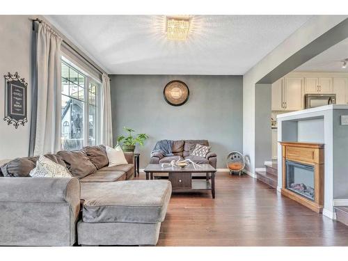 454 Auburn Crest Way Se, Calgary, AB - Indoor Photo Showing Living Room With Fireplace