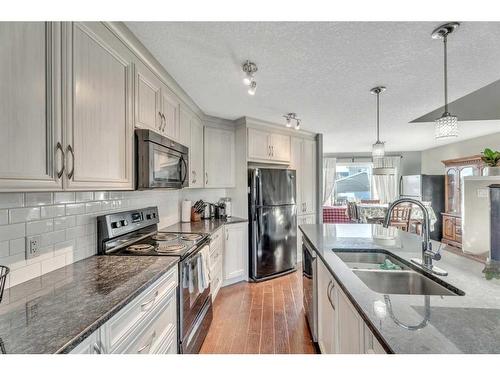 454 Auburn Crest Way Se, Calgary, AB - Indoor Photo Showing Kitchen With Double Sink With Upgraded Kitchen