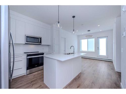 3407-111 Wolf Creek Drive Se, Calgary, AB - Indoor Photo Showing Kitchen With Upgraded Kitchen