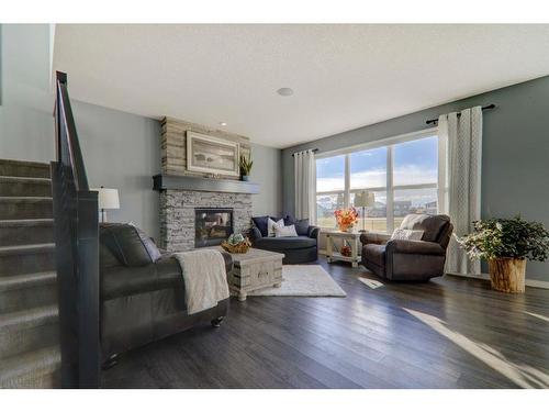 6 Ranchers Bay, Okotoks, AB - Indoor Photo Showing Living Room With Fireplace