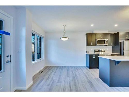 822 Windbury Street Sw, Airdrie, AB - Indoor Photo Showing Kitchen With Stainless Steel Kitchen With Upgraded Kitchen