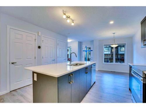 822 Windbury Street Sw, Airdrie, AB - Indoor Photo Showing Kitchen With Double Sink