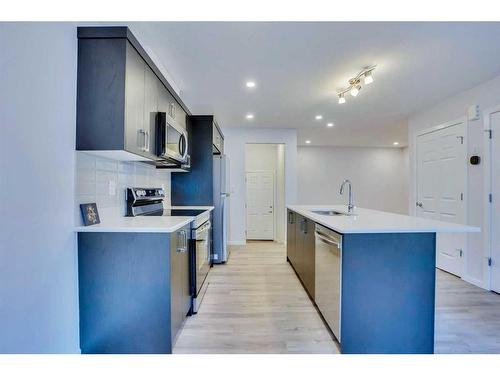 822 Windbury Street Sw, Airdrie, AB - Indoor Photo Showing Kitchen With Upgraded Kitchen