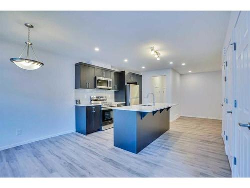 822 Windbury Street Sw, Airdrie, AB - Indoor Photo Showing Kitchen With Upgraded Kitchen