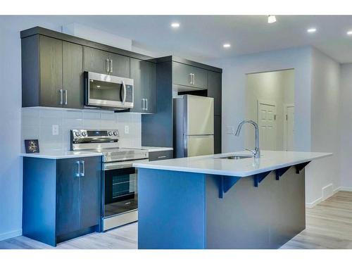 822 Windbury Street Sw, Airdrie, AB - Indoor Photo Showing Kitchen With Upgraded Kitchen