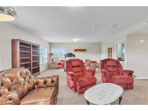 1043 Kings Heights Way Se, Airdrie, AB - Indoor Photo Showing Living Room