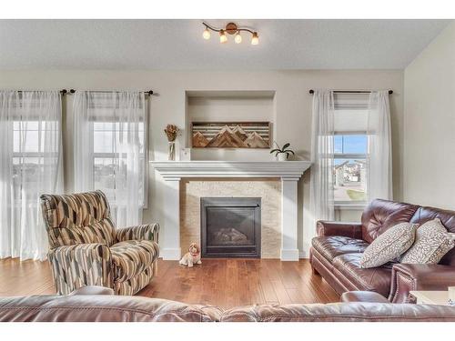 1043 Kings Heights Way Se, Airdrie, AB - Indoor Photo Showing Living Room With Fireplace