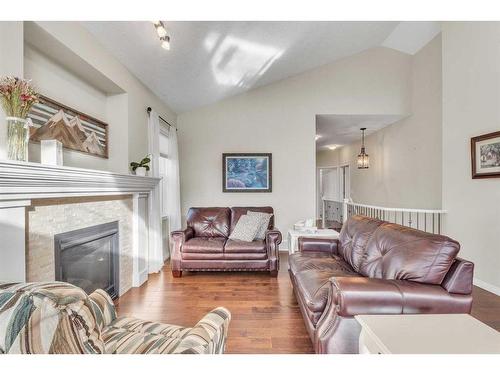 1043 Kings Heights Way Se, Airdrie, AB - Indoor Photo Showing Living Room With Fireplace