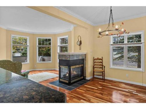 19-164 Rundle Drive, Canmore, AB - Indoor Photo Showing Living Room With Fireplace