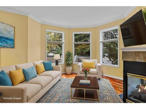 19-164 Rundle Drive, Canmore, AB - Indoor Photo Showing Living Room With Fireplace