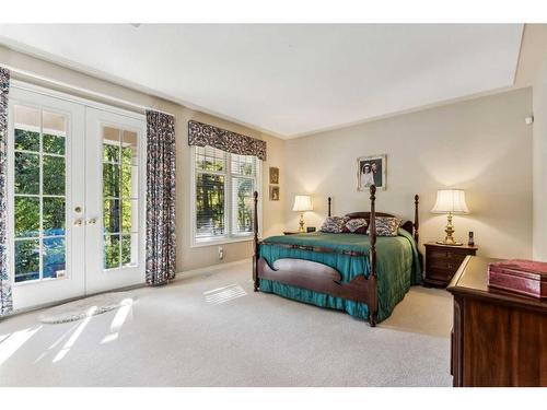 107 Sunrise Way, Priddis Greens, AB - Indoor Photo Showing Bedroom